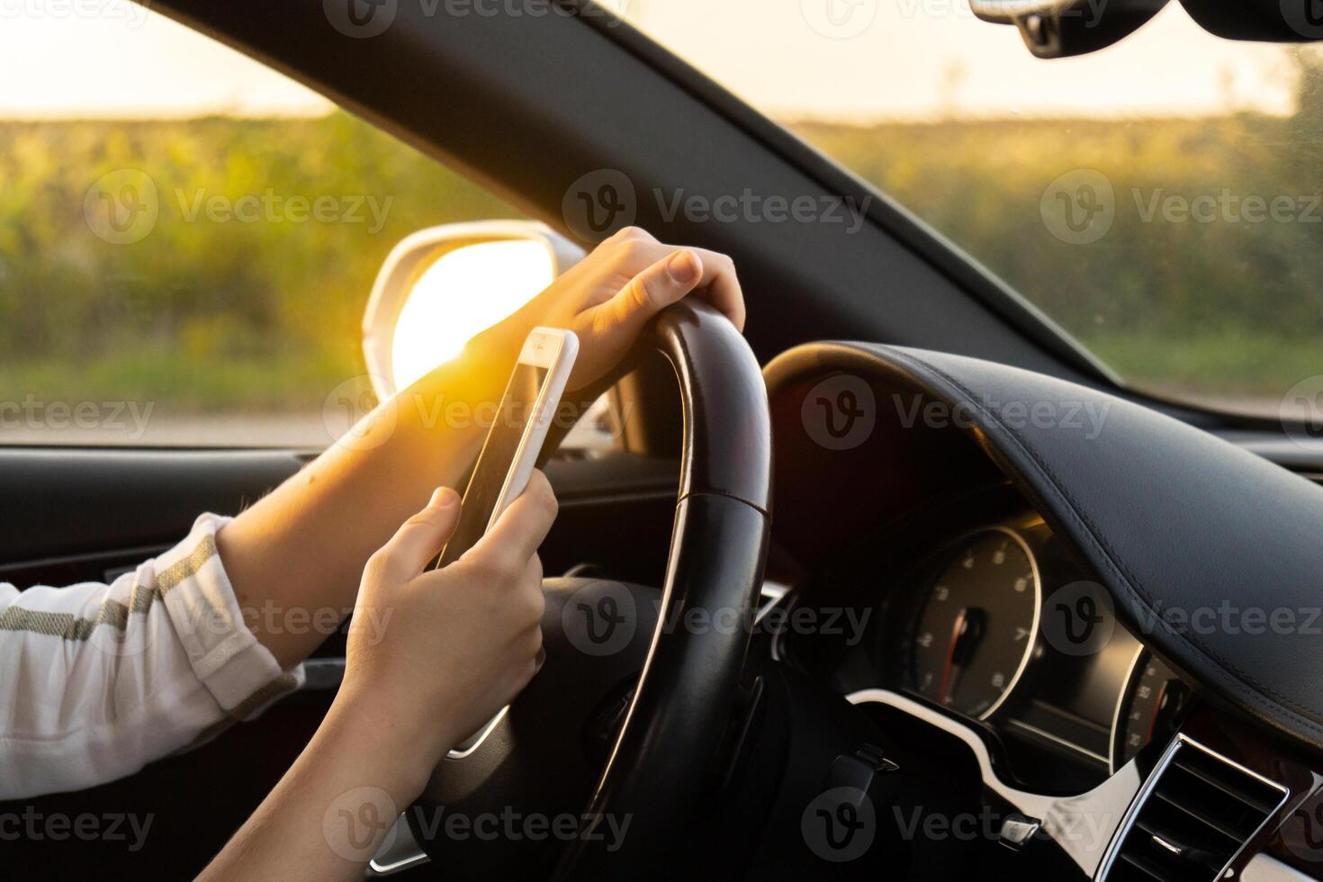 Womandriver using mobile phone paying for parking and navigating in the city while stopped on the side of the road. Self road trip, technology, travel and people concept photo