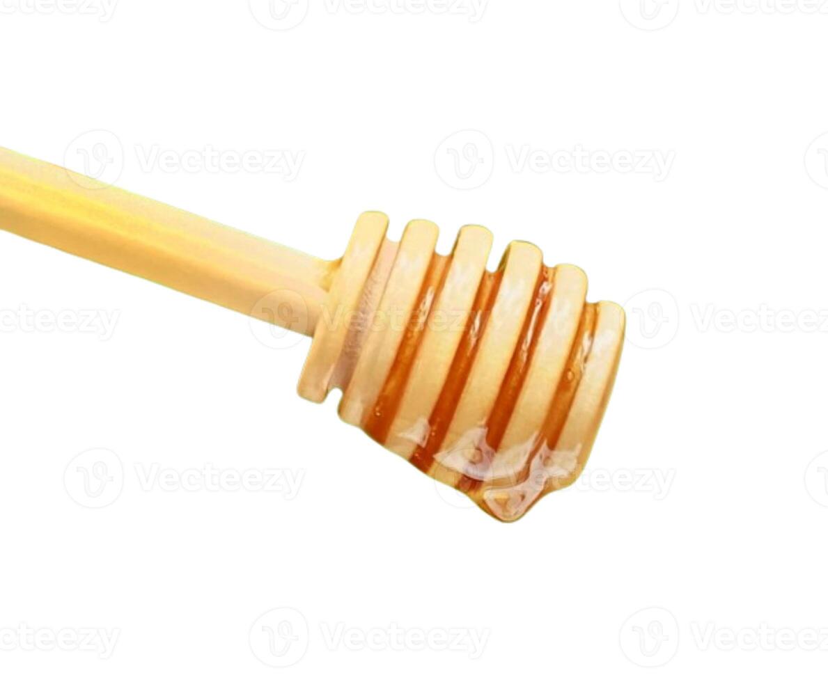 Wooden spoon honey isolated on white background photo