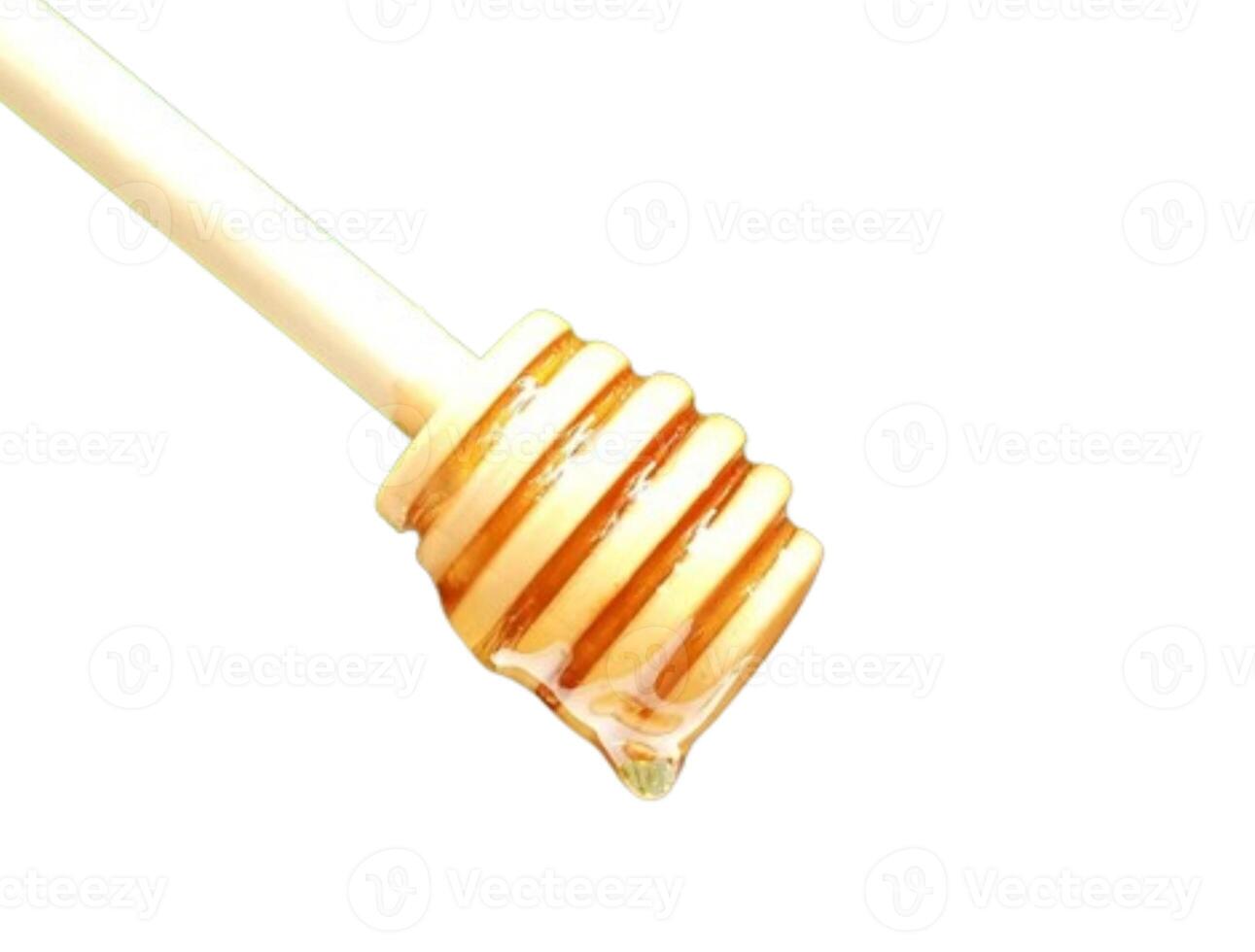 Wooden spoon honey isolated on white background photo