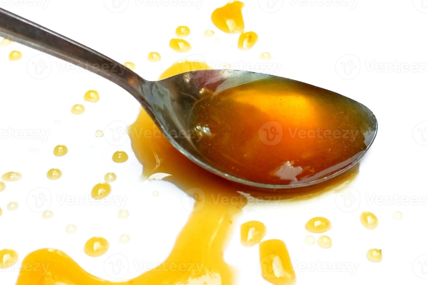 cuchara de miel aislado en blanco antecedentes foto