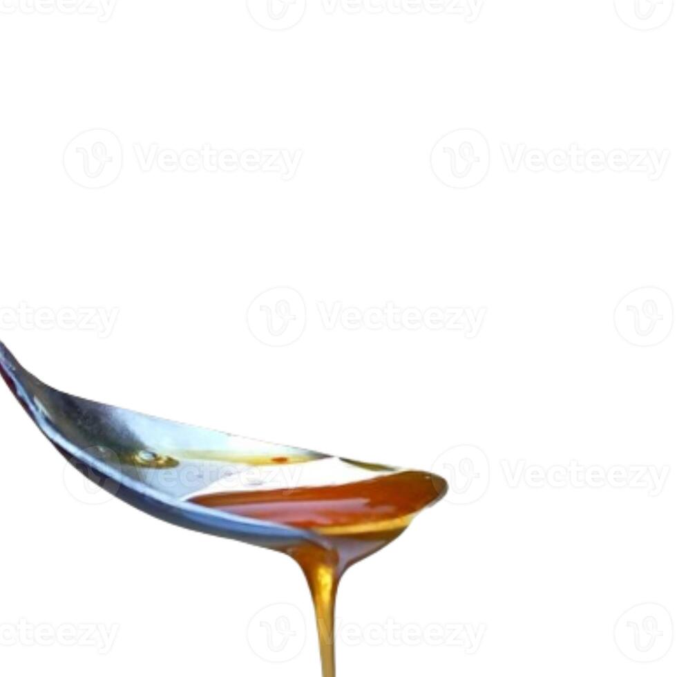 Spoon of honey isolated on white background photo