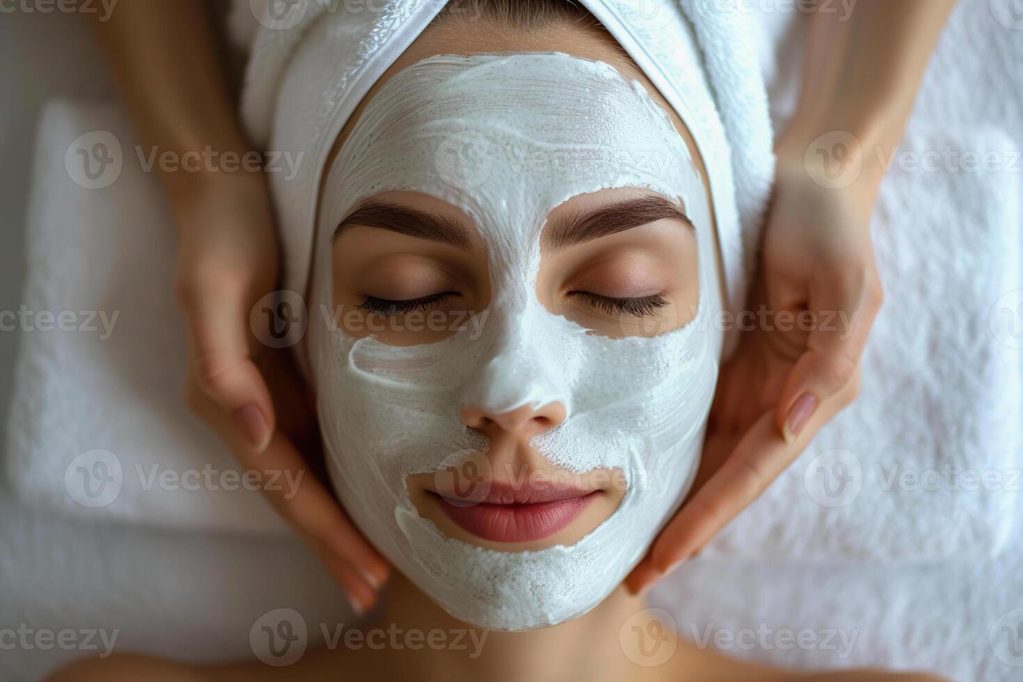 Woman relaxing with green facial mask in spa setting, top view photo