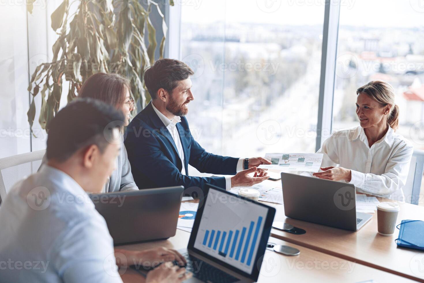 Creative business people working on business project in modern office with panoramic view photo