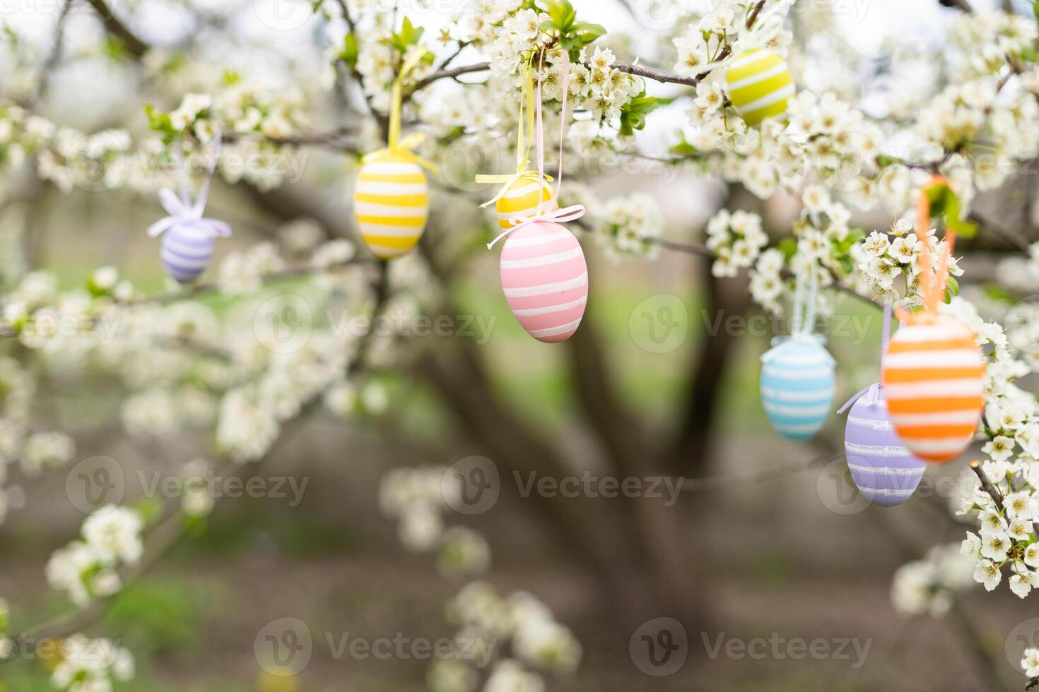 Easter decorative composition with painted eggs, flowering branches. photo