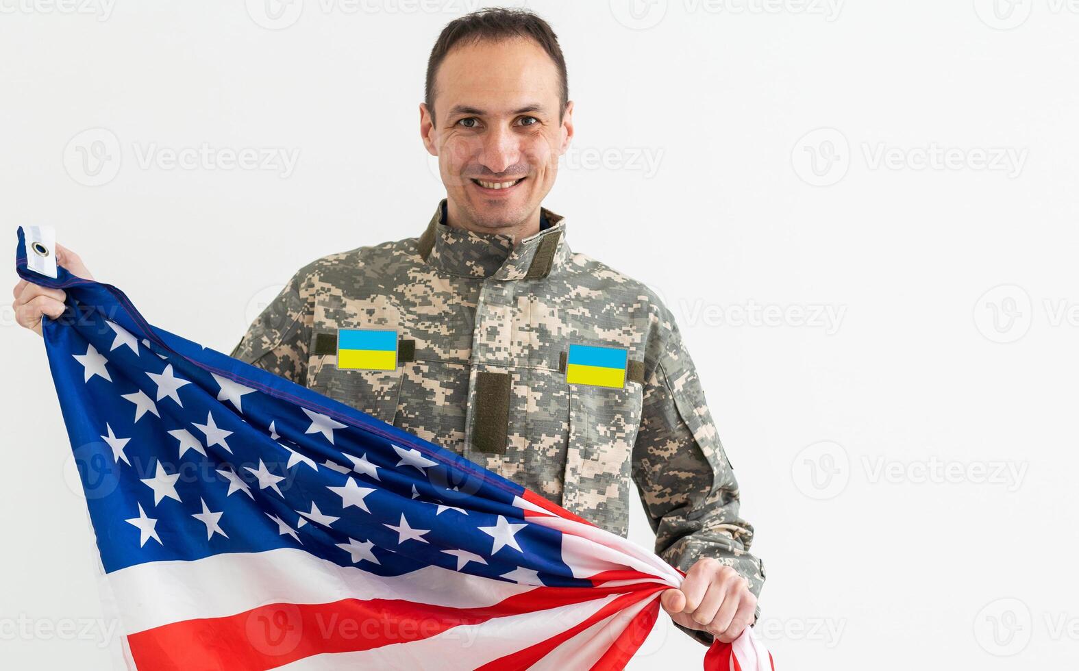 Ukrainian military man with USA flag photo