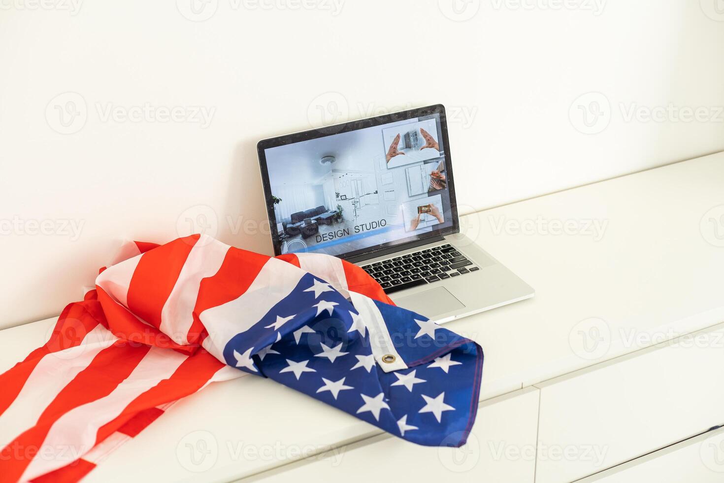 booking on the computer. laptop and american flag photo