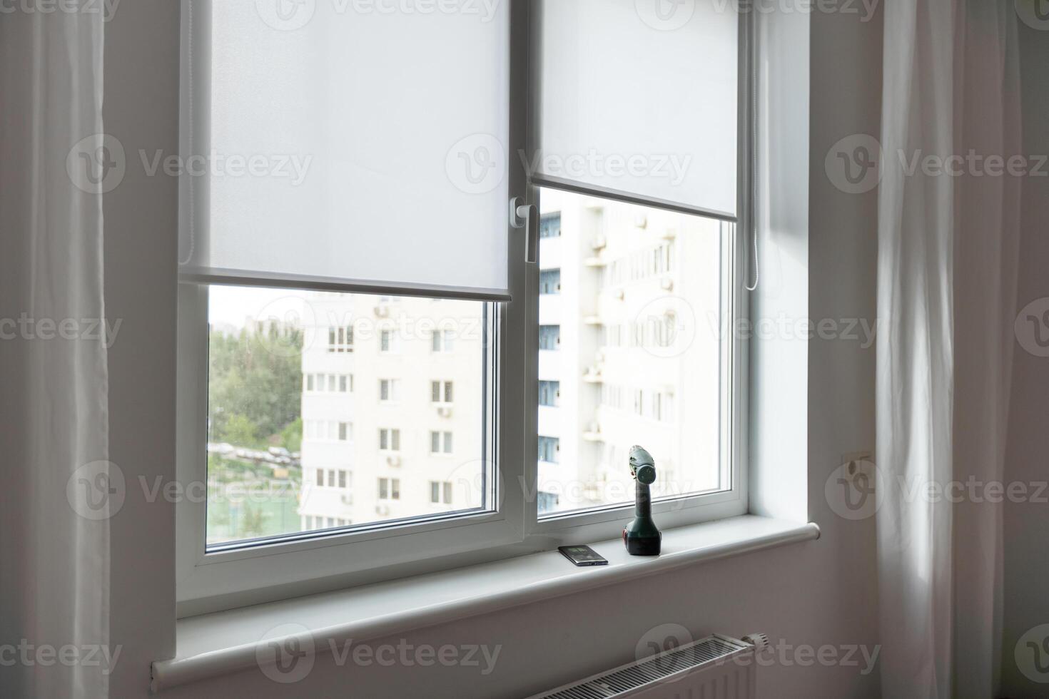 Light room with window and open curtains. Home interior photo