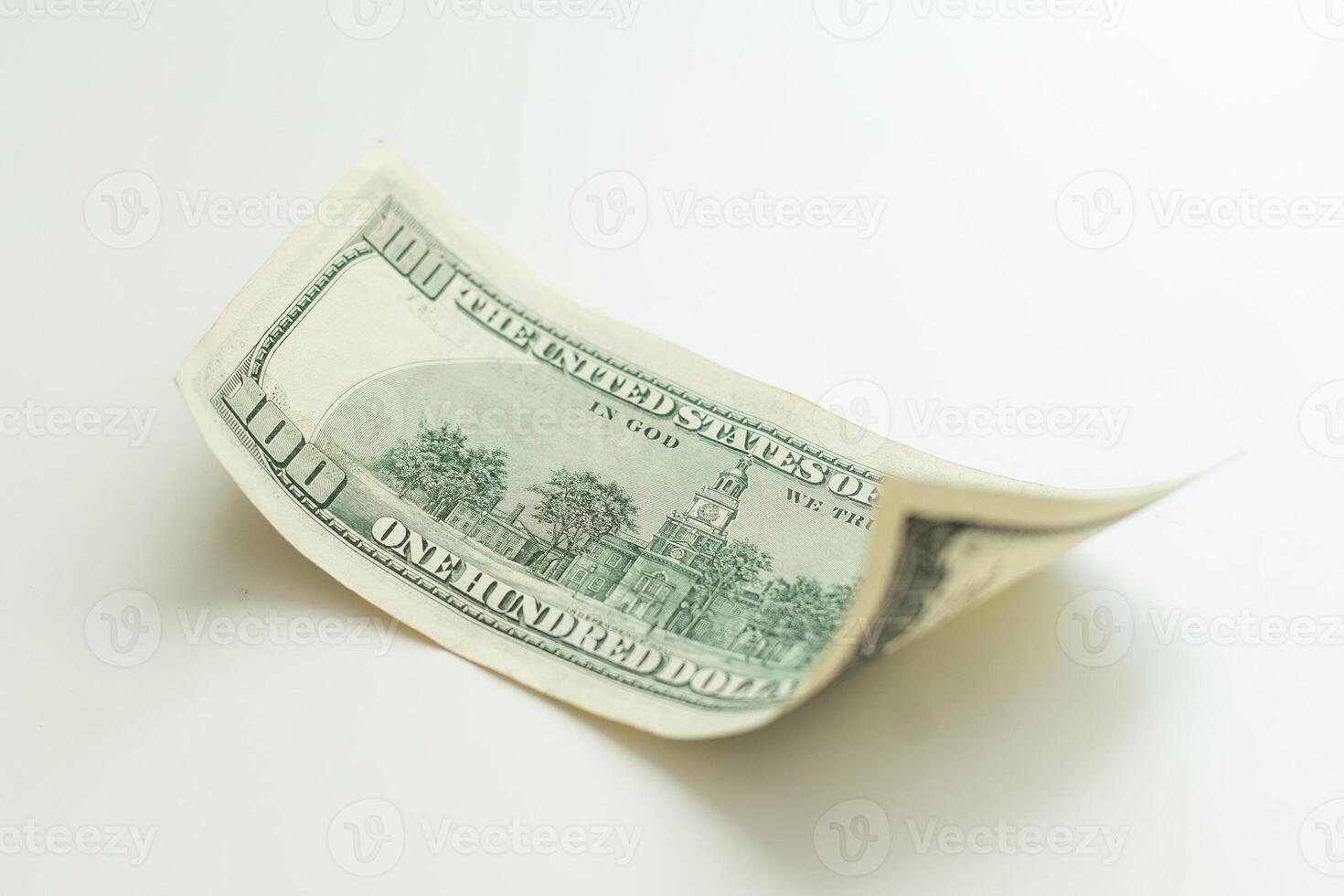 one hundred dollar bill closeup on white background photo