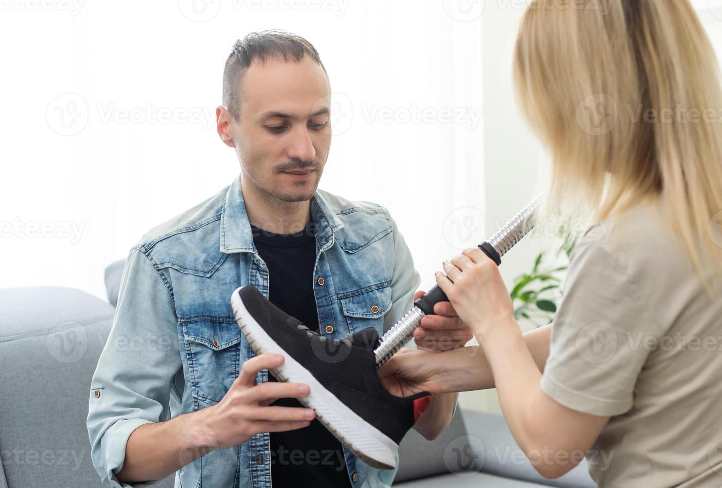 Technician testing robotic bionic leg at prosthetic manufacturing photo