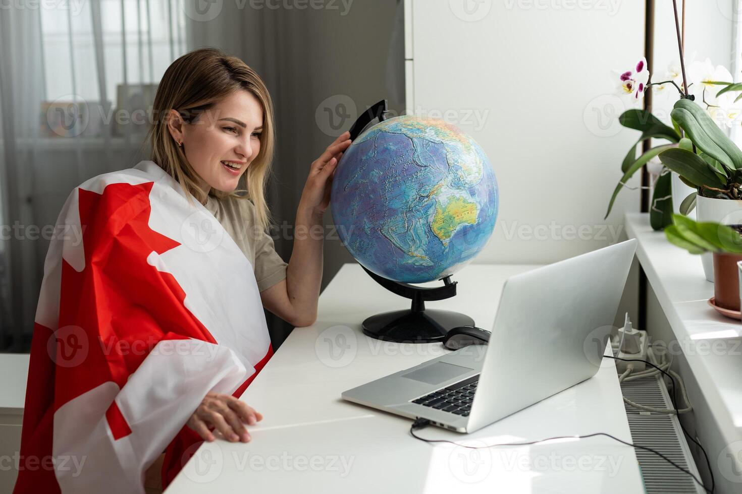 Young female student with Canadian flag and laptop with space for text photo