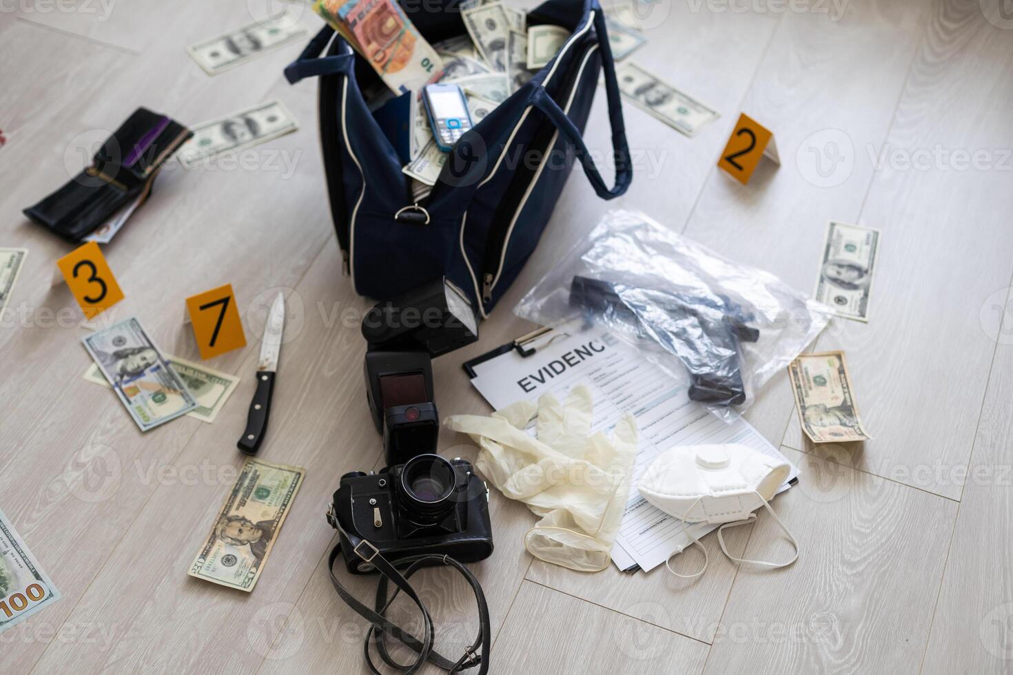 Black duffel bag full of dollar notes in criminal investigation unit, conceptual image photo