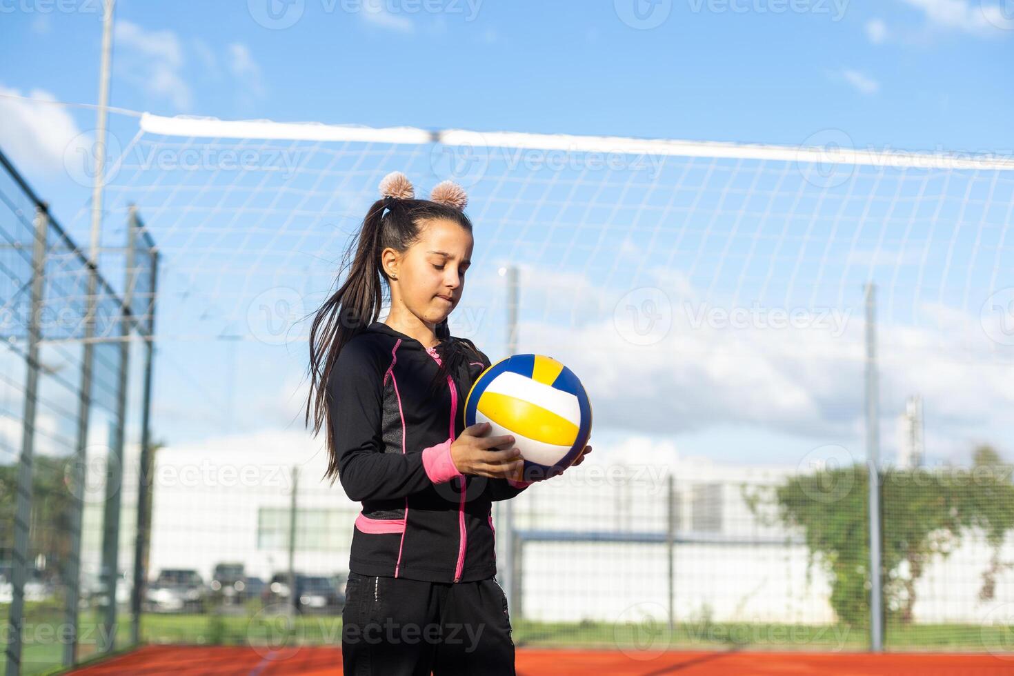 little girl with a volleyball ball photo