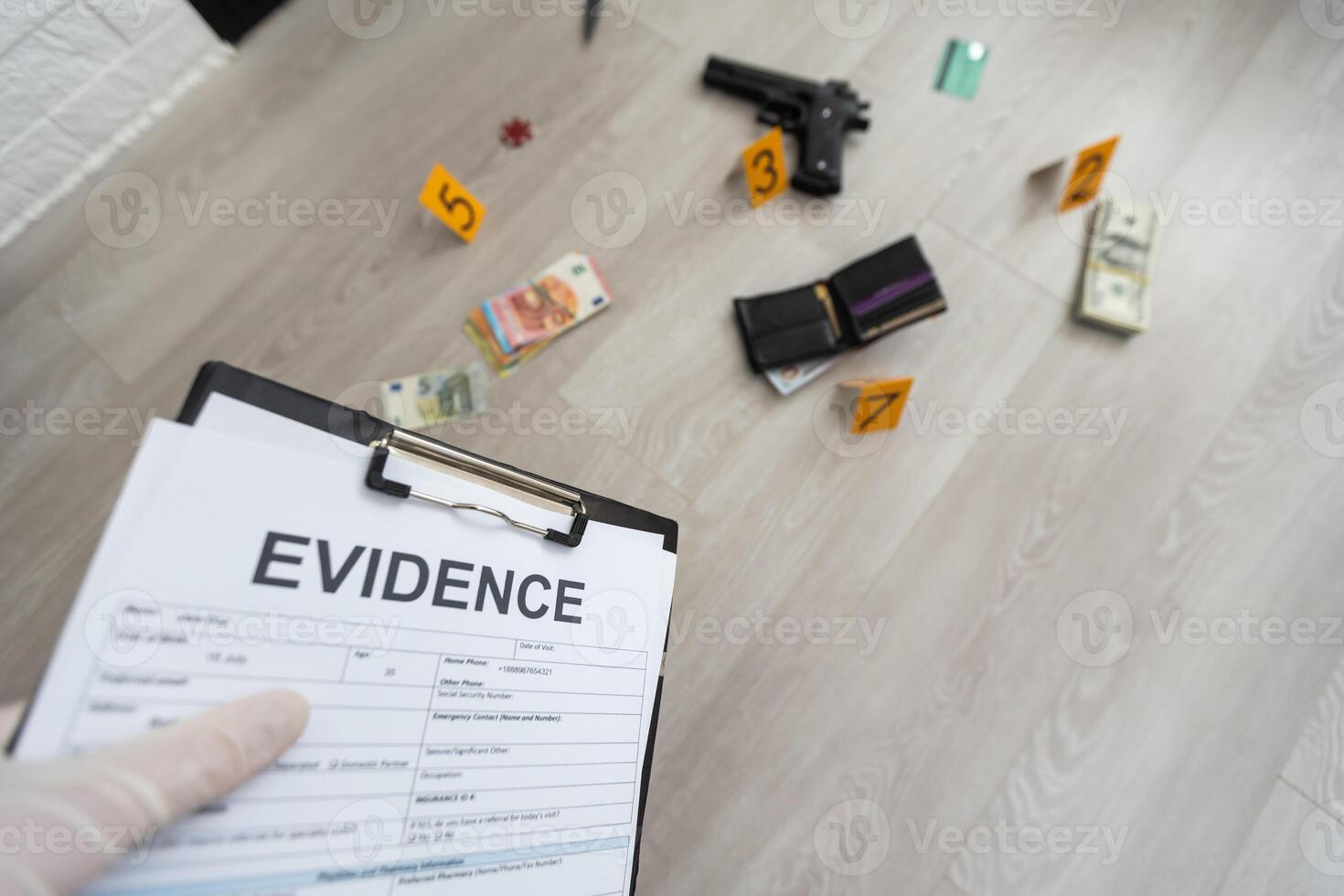 Close up on hands of unknown man forensic police investigator collecting evidence in the plastic bag at the crime scene investigation photo