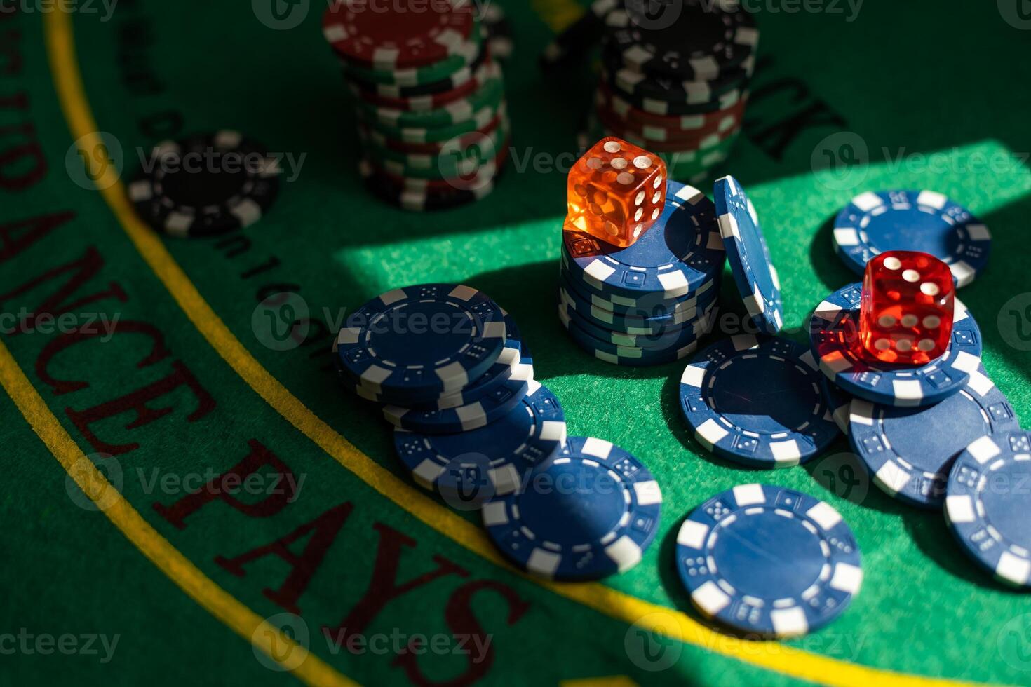Blur background and chips, Stack of poker chips on a green table. Poker game theme photo