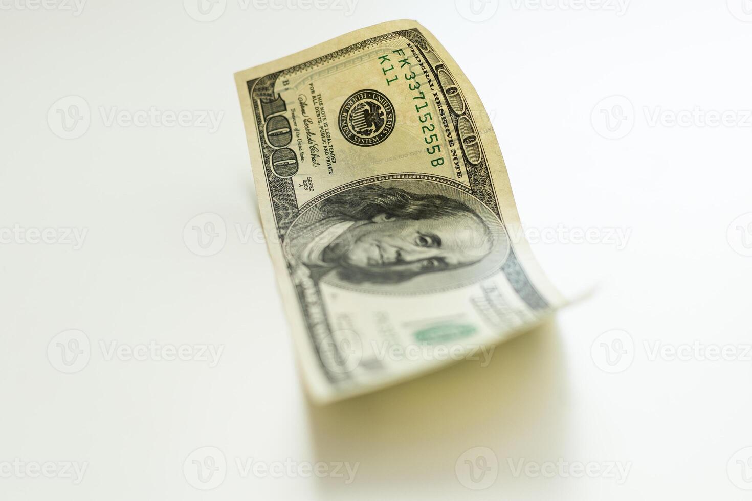 Bill in one hundred dollars isolated on white background. photo