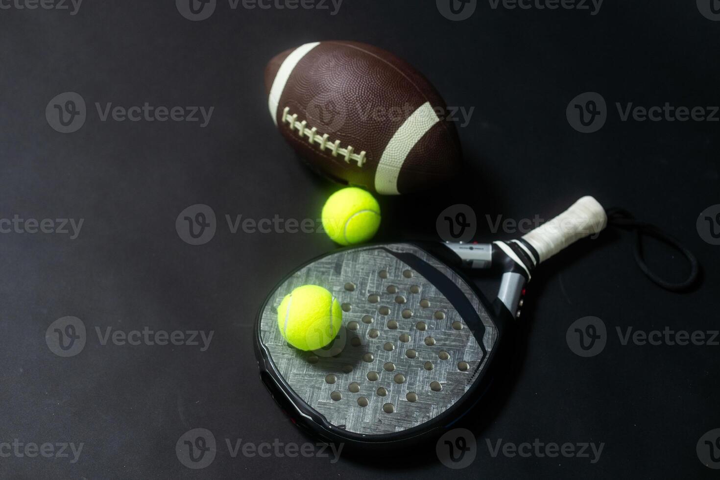 Set of sport equipment on floor, padel tennis, ball rugby photo