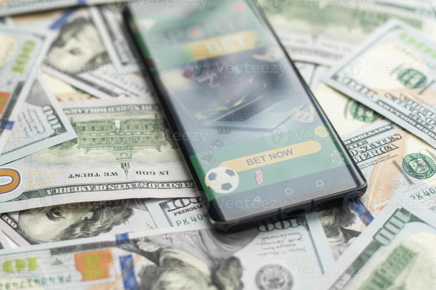 dollars and euros, smartphone with sports bet application photo