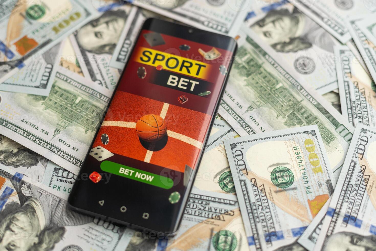 Sports betting website in a mobile phone screen, money photo