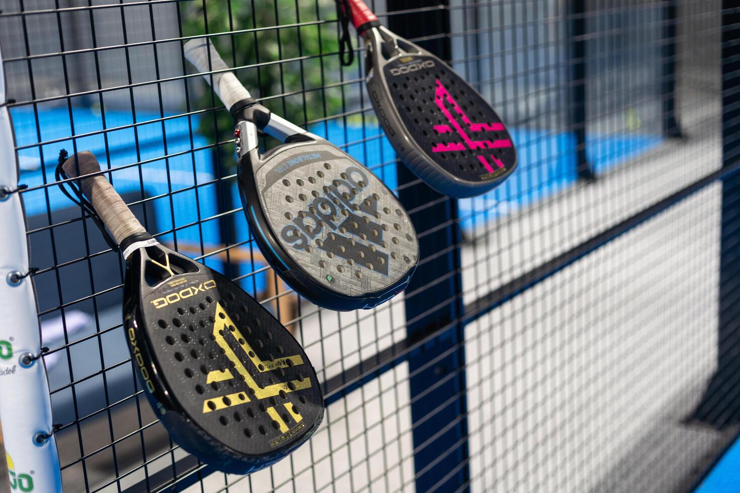 Kyiv, Ukraine. March 22, 2024, Paddle tennis rackets on the court photo