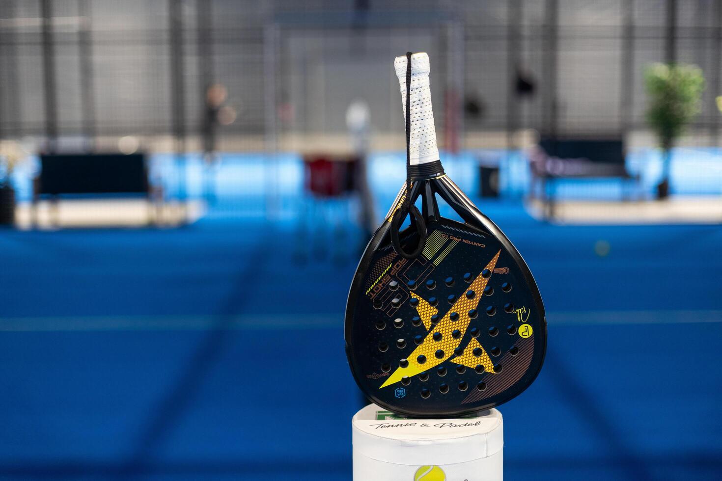Kyiv, Ukraine. March 22, 2024 Paddle tennis. Paddel racket in front of an outdoor court photo