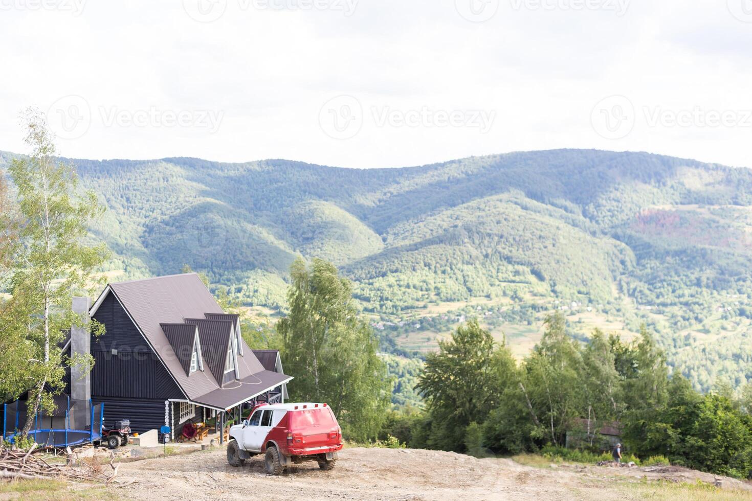 old wooden house in spring Carpathian mountains in Ukraine photo