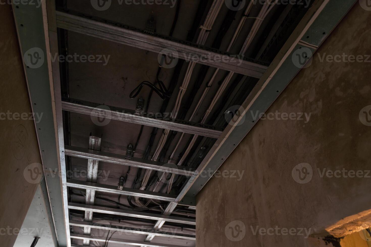 Electrical wiring in a protective corrugation. Installation and wiring of electrical networks in an apartment or house. Close-up photo