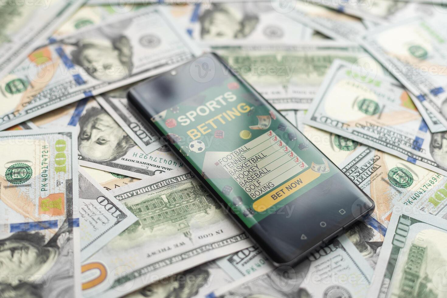 Smartphone with gambling mobile application with money close-up. Sport and betting concept photo