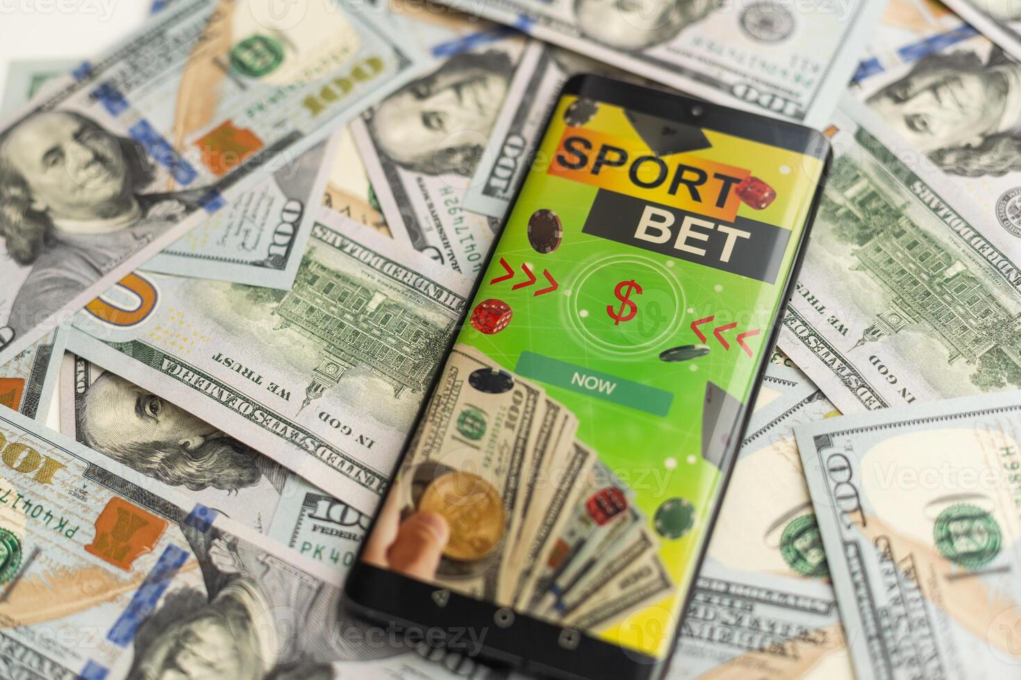 betting on sports, smart phone with working online betting mobile application photo