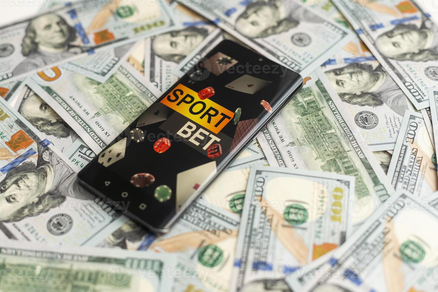 Sports betting website in a mobile phone screen, money photo