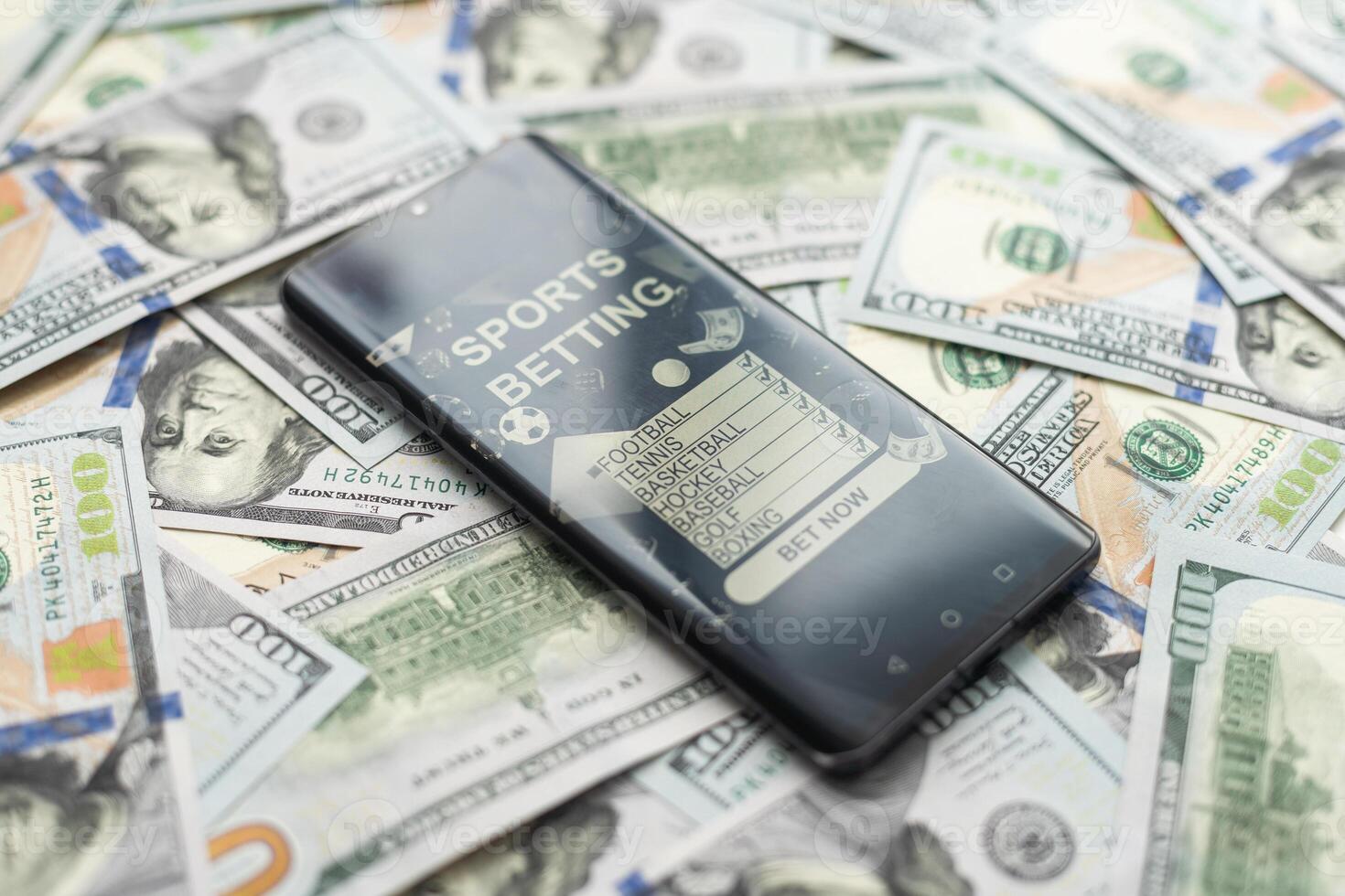 dollars and euros, smartphone with sports bet application photo