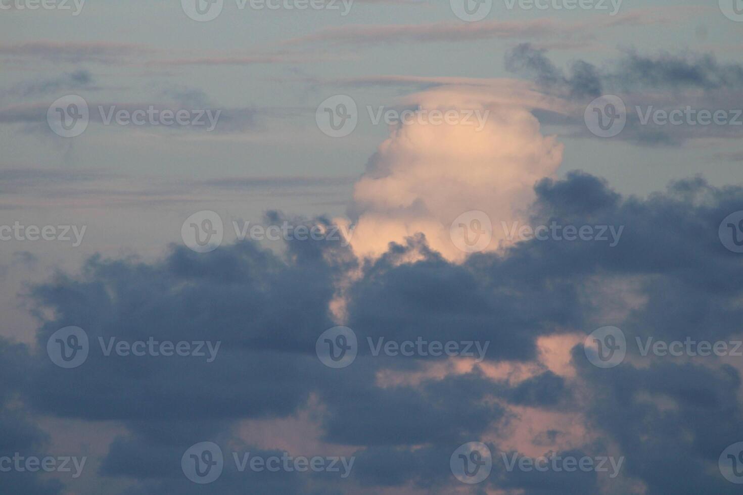 Clouds In THe Sky On A Bright Sunny Day photo