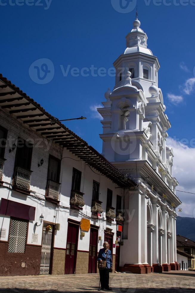 Senior woman tourist at the beautiful heritage town of Salamina in the department of Caldas in Colombia photo