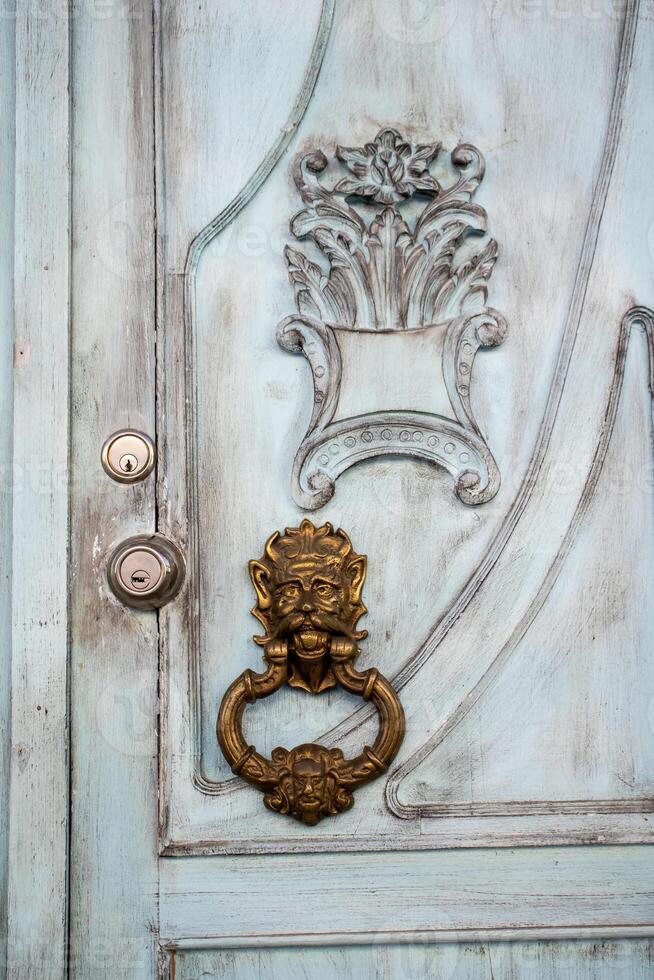 Detail of a beautiful door of the houses at the historical downtown of the heritage town of Salamina located at the Caldas department in Colombia. photo