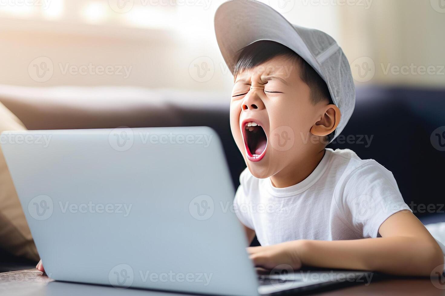 AI generated yawning 10 yo Asian boy in white t-shirt and baseball cap sitting in front of an open laptop. themes of boredom, tiredness, online learning, remote work, youth culture, technology photo