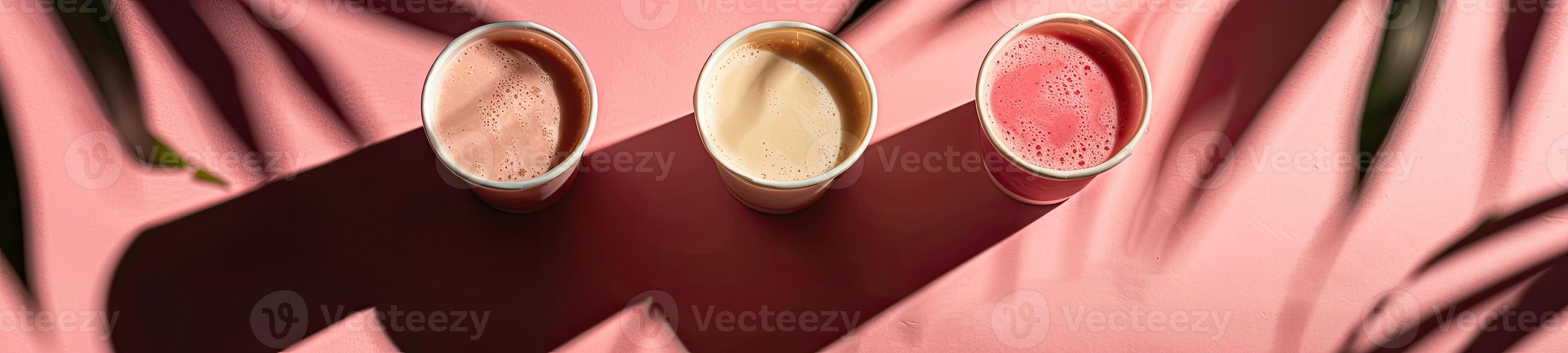 Some cups of smoothies, minimalist background, shadow leafs photo