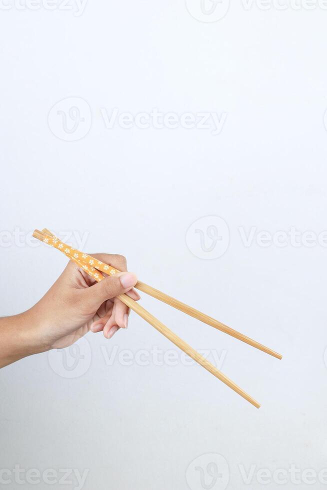 Female Hand Holding Chopstick photo