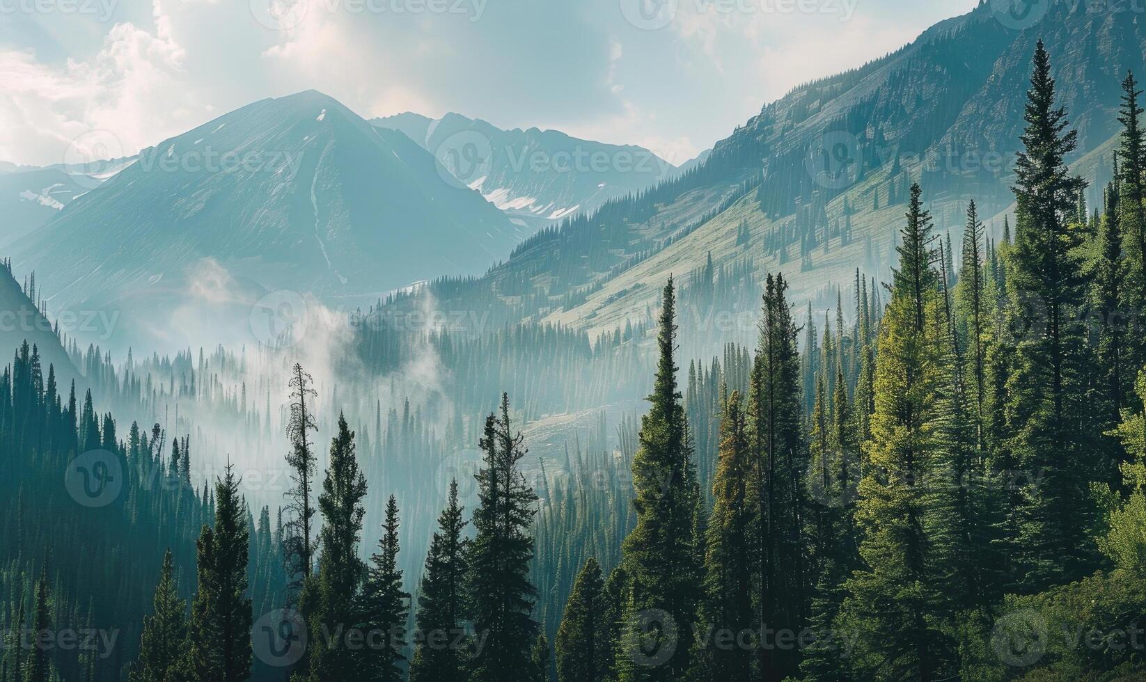 A picturesque mountain landscape with towering pine trees lining the rugged slopes photo