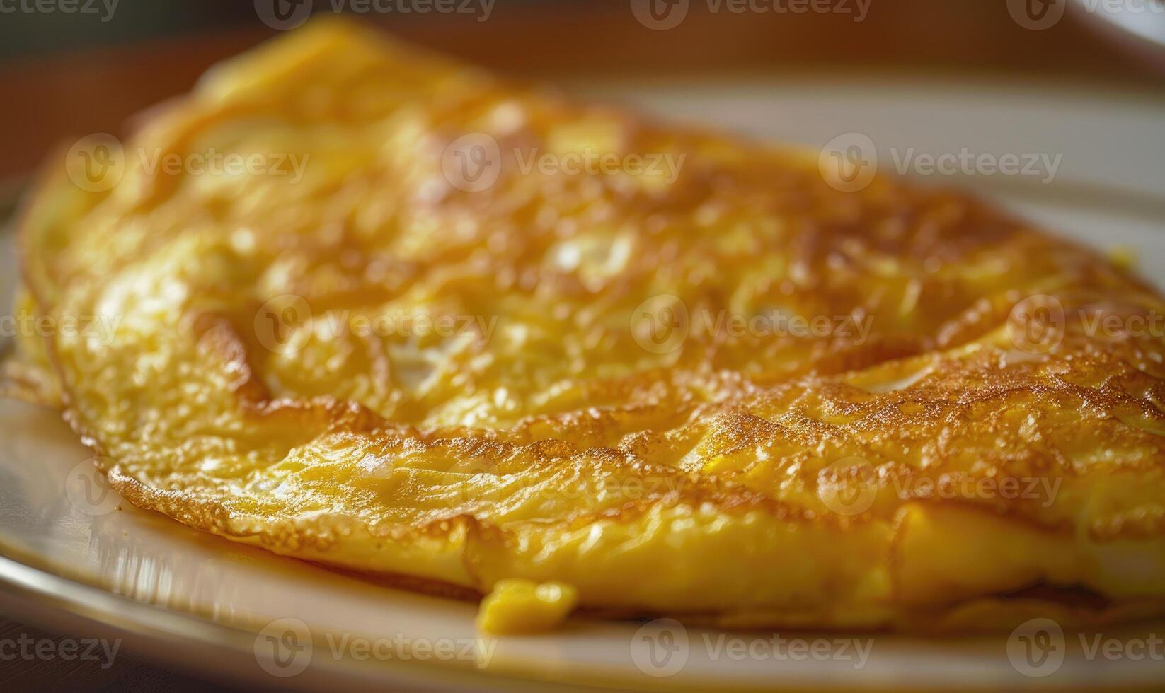 Close-up of a golden omelette on a plate photo