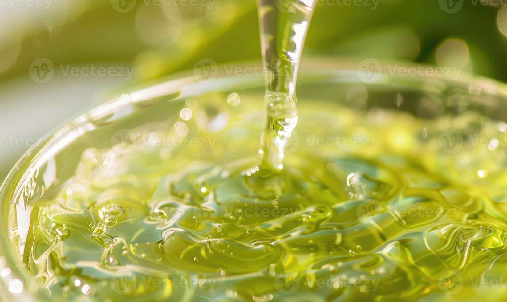 Close-up of aloe vera gel being extracted and blended with botanical oils and essences photo