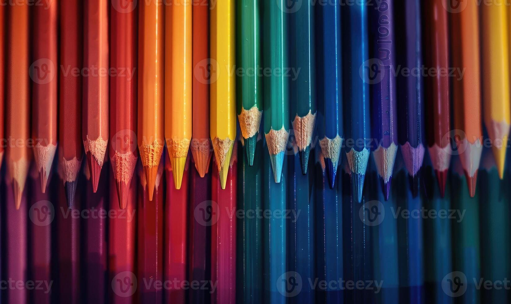 Colored pencils arranged neatly in a row photo