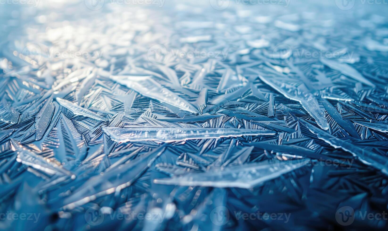 Close-up of icy patterns forming on the surface of a frozen lake photo