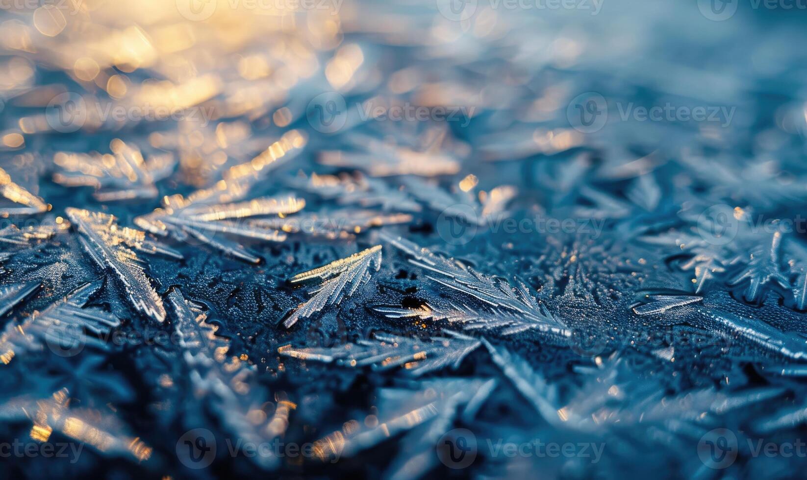 Close-up of icy patterns forming on the surface of a frozen lake photo