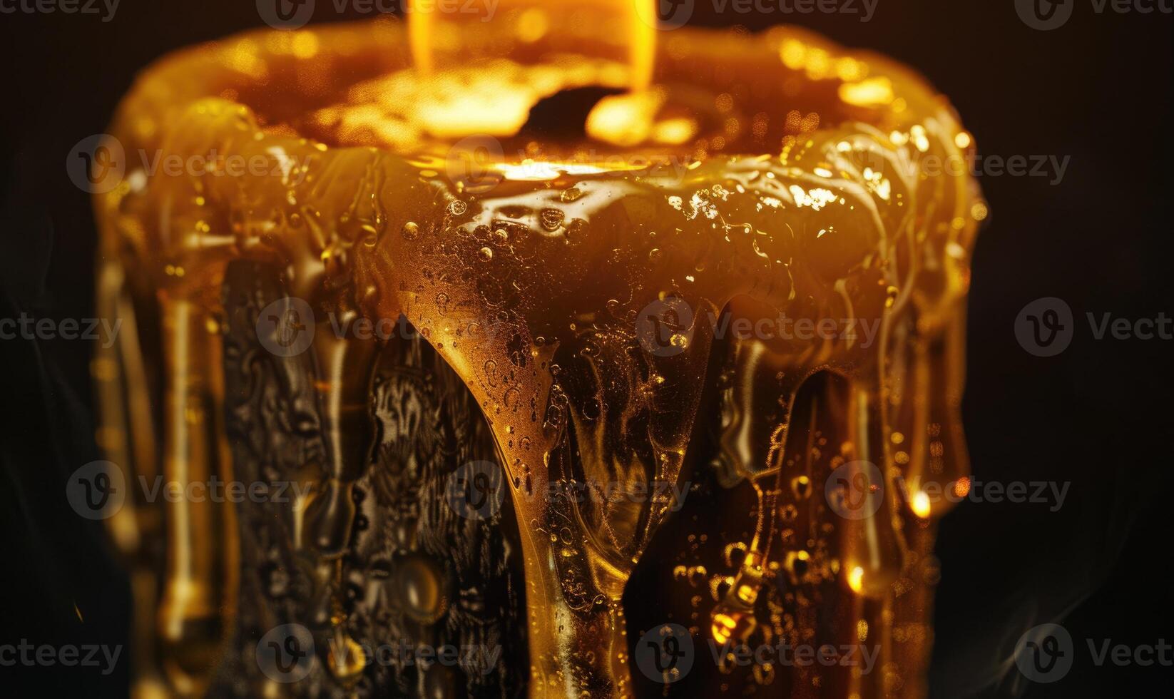 Close-up of a melting candle with wax dripping down the side photo