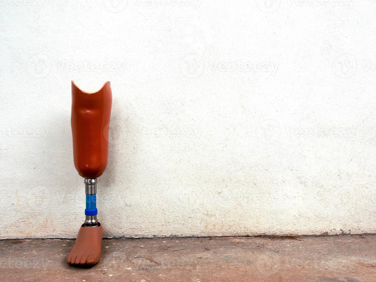 Prosthetic legs against the wall photo