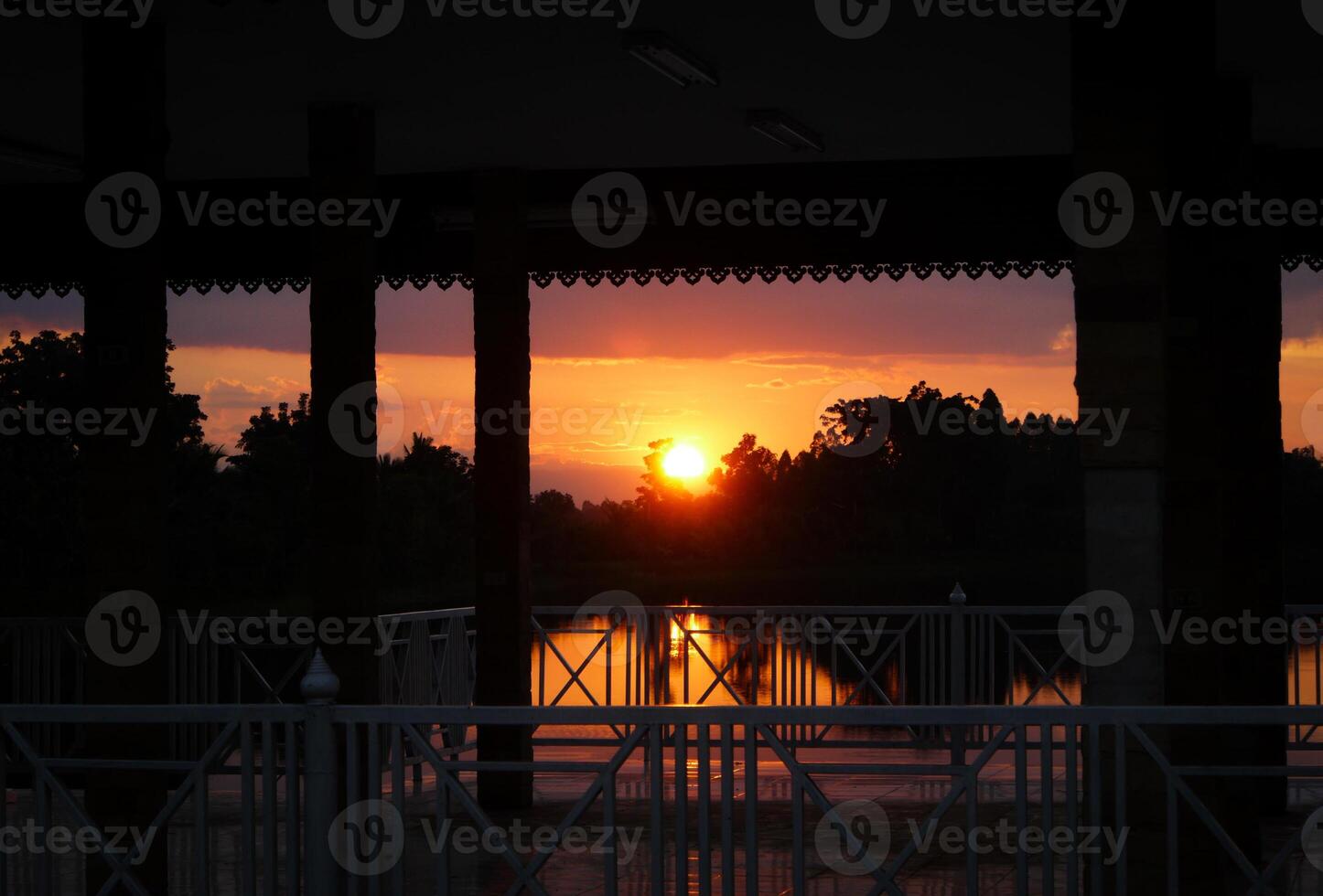Spectacular sunset over, orange sun rising up over the horizon photo