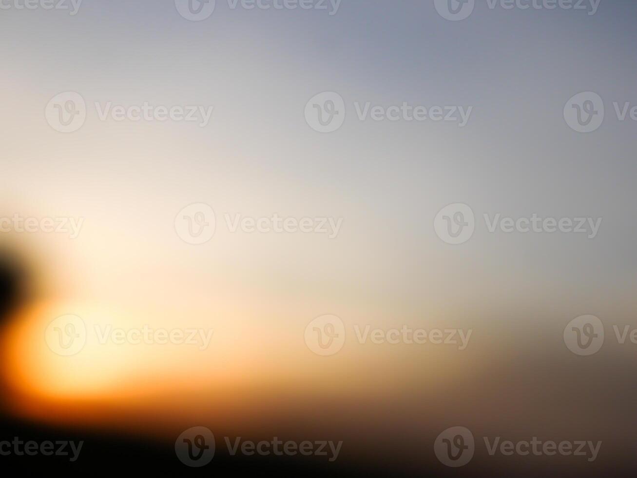 Spectacular sunset over, orange sun rising up over the horizon photo