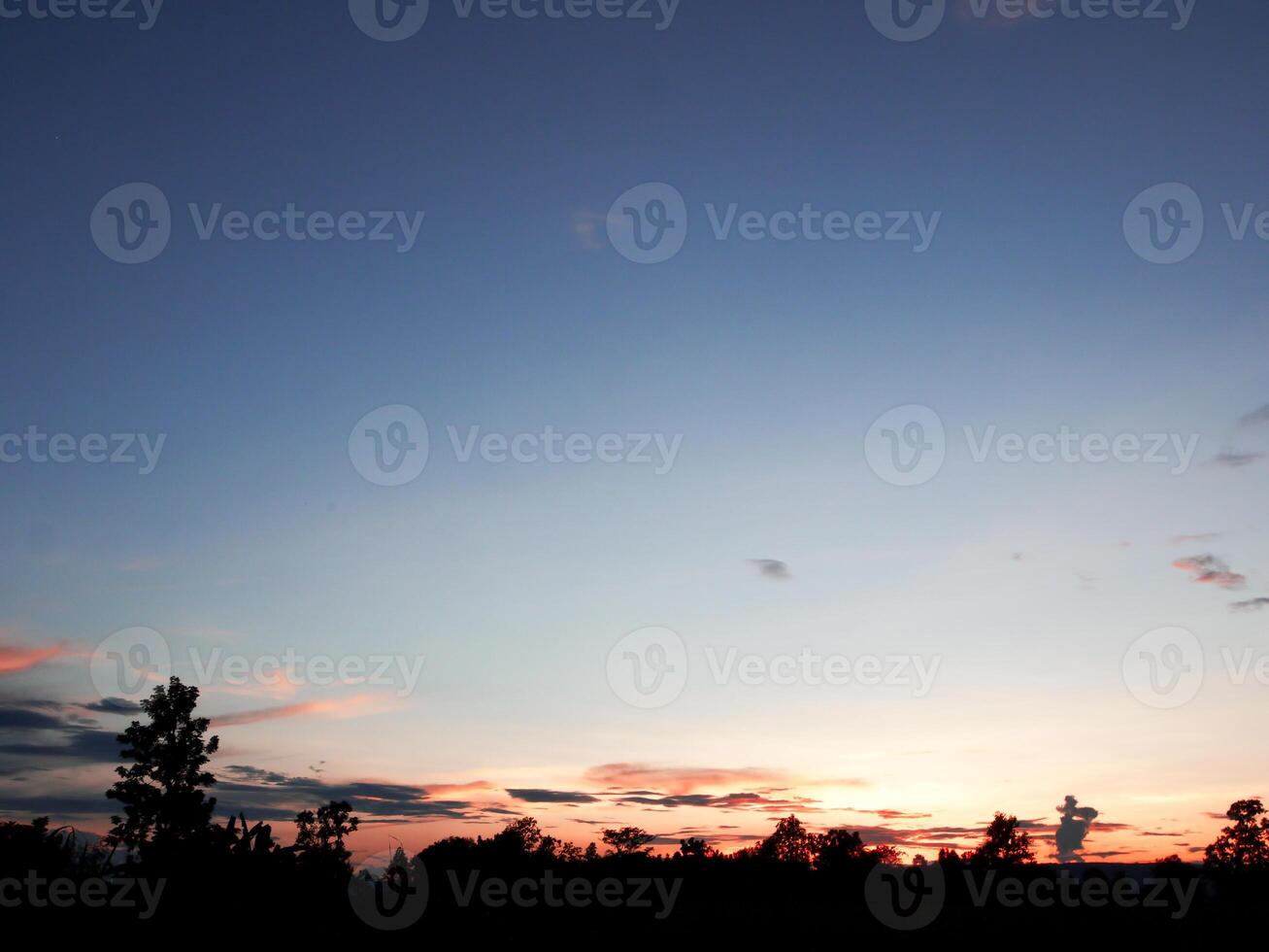 Spectacular sunset over, orange sun rising up over the horizon photo