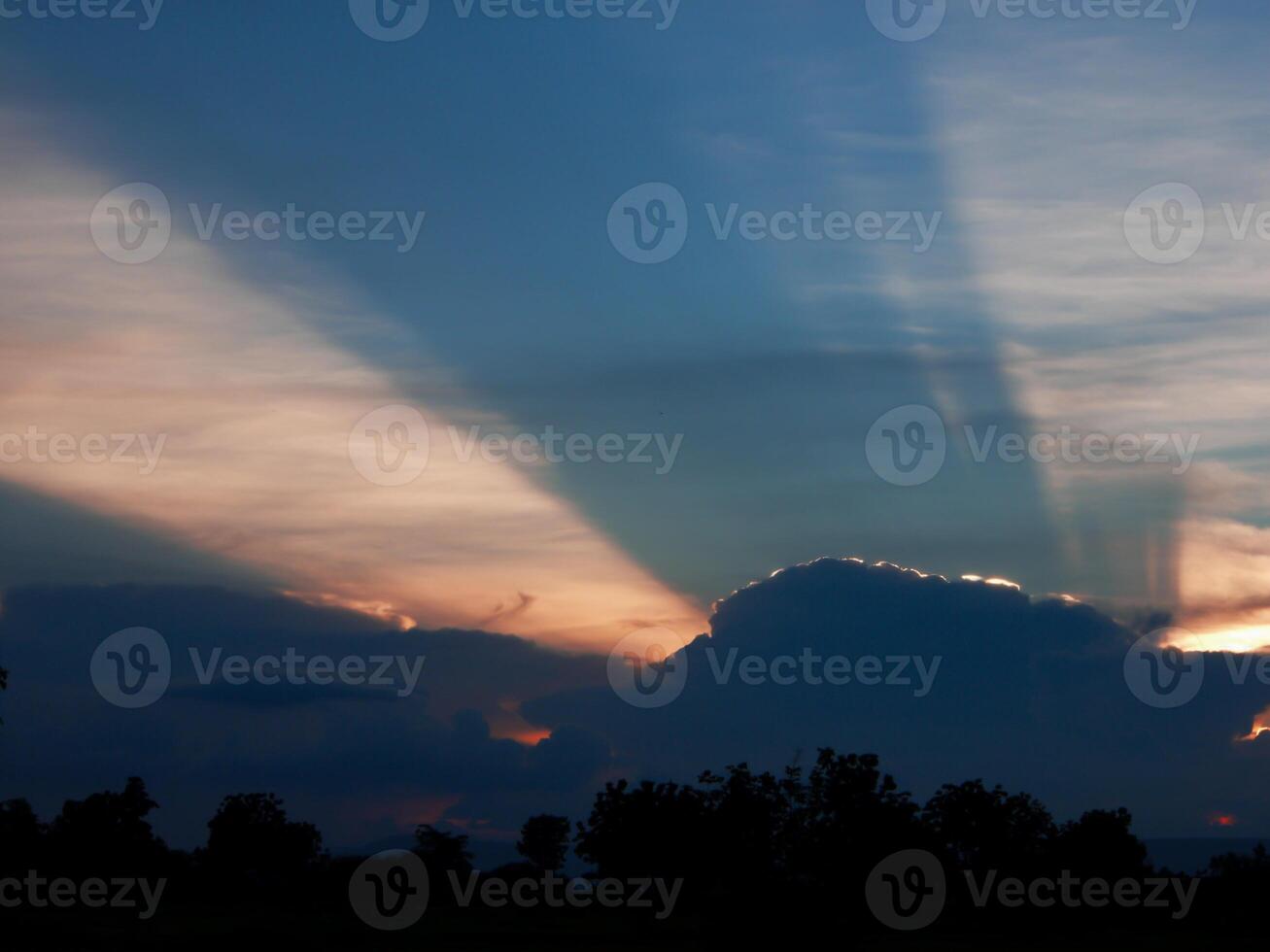 Spectacular sunset over, orange sun rising up over the horizon photo