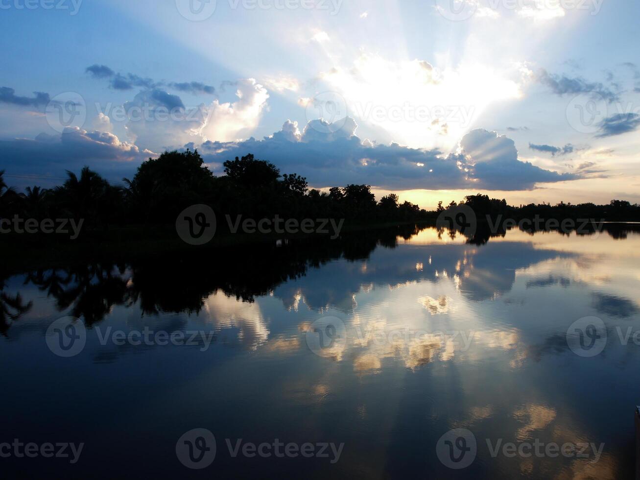 Spectacular sunset over, orange sun rising up over the horizon photo