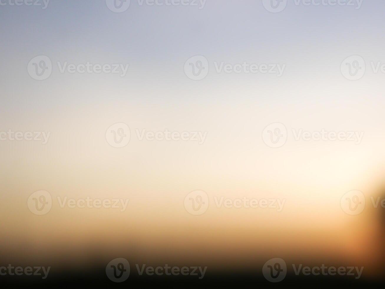 Spectacular sunset over, orange sun rising up over the horizon photo